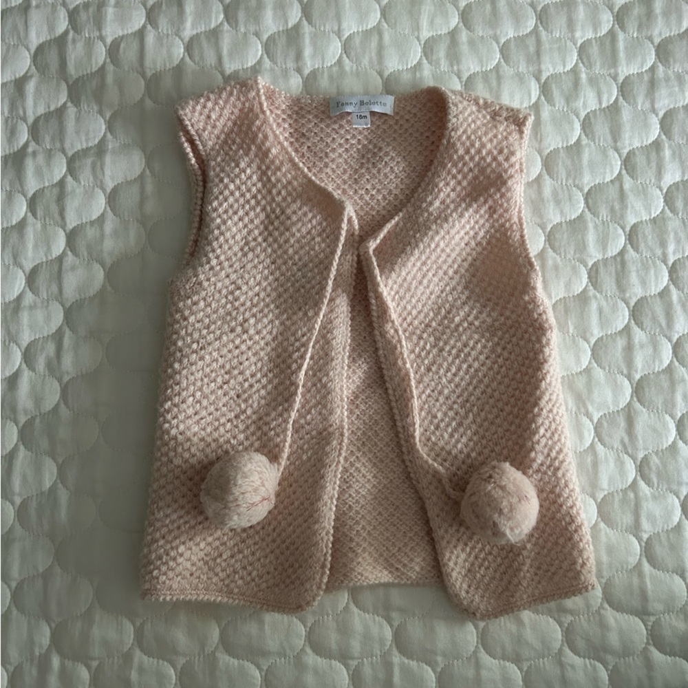 Sweater vest with pompoms